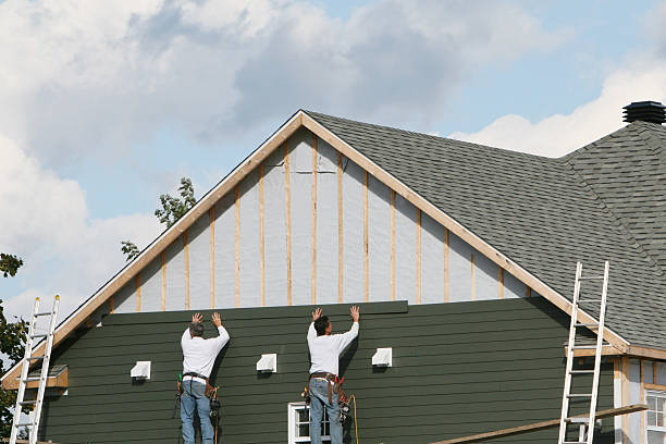 Professional Siding technician working in Medford, NY